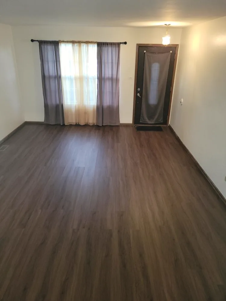 Crisp white walls with new vinyl plank flooring