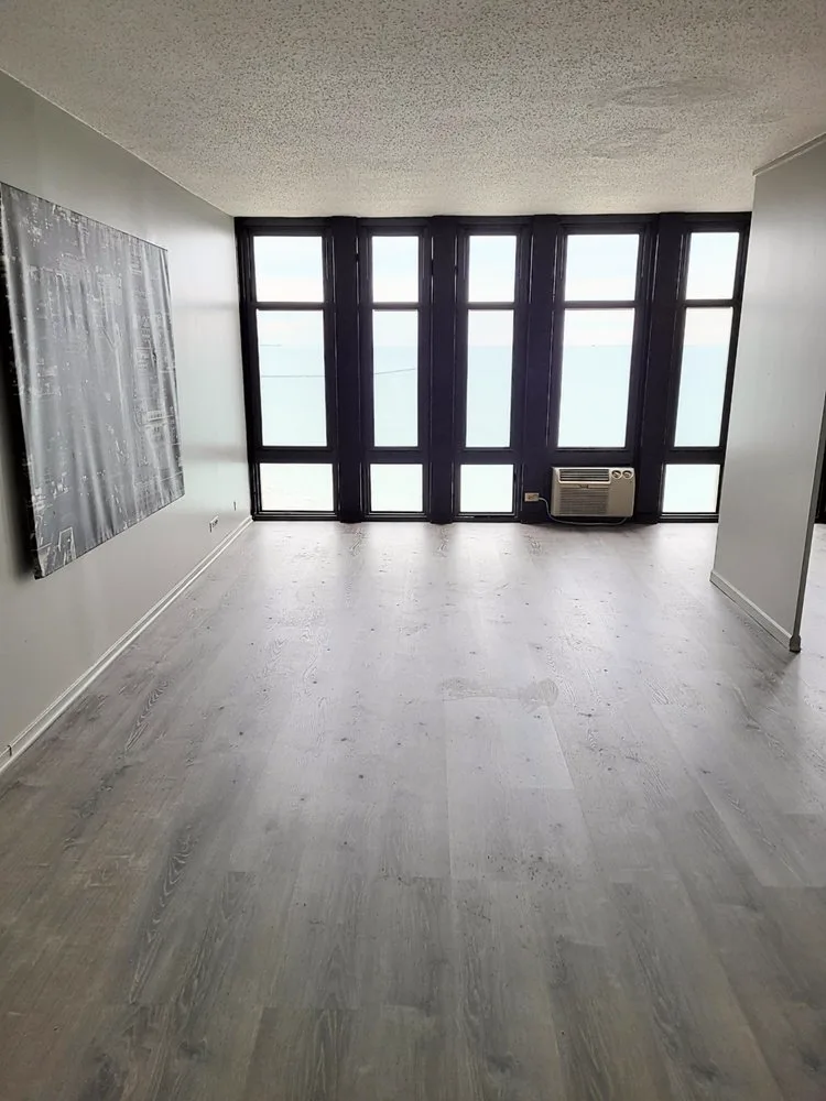 Open living space repainted in warm gray tones
